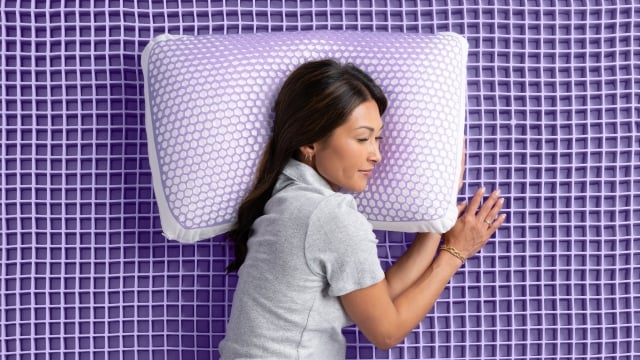 Woman sleeping on exposed Grid pillow and Grid mattress