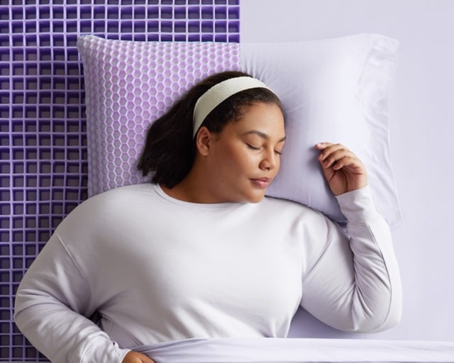 Woman on Half Exposed Grid Mattress and pillow