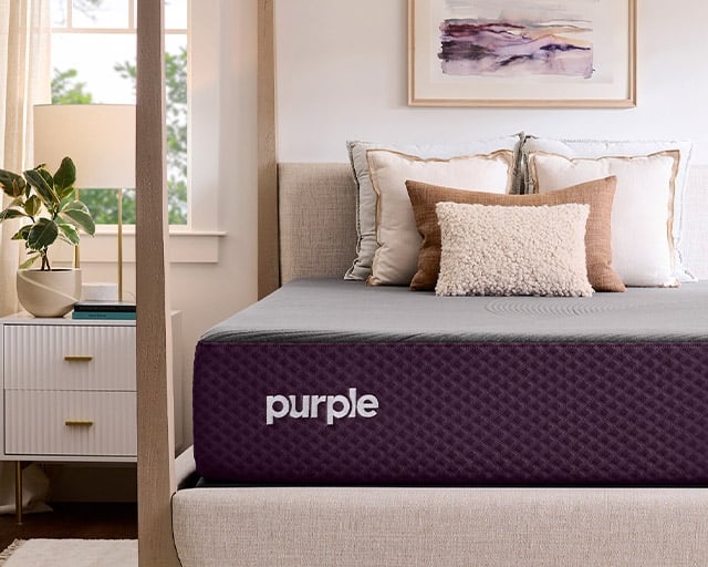 A Purple Restore mattress in a contemporary bedroom.