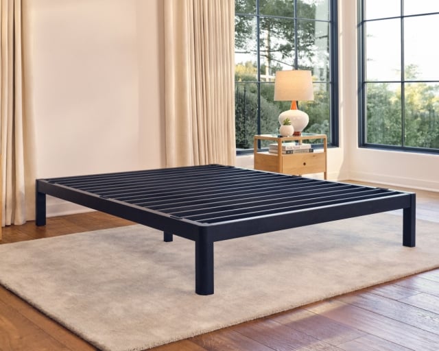 The Purple Metal Platform bed frame in a well-lit bedroom.