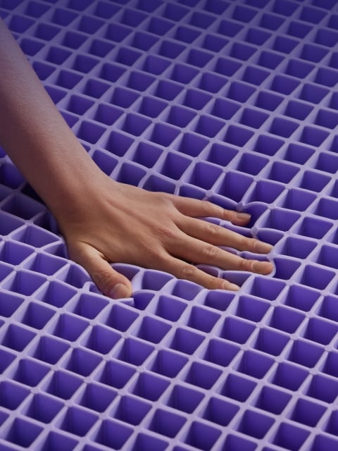 hand press on grid